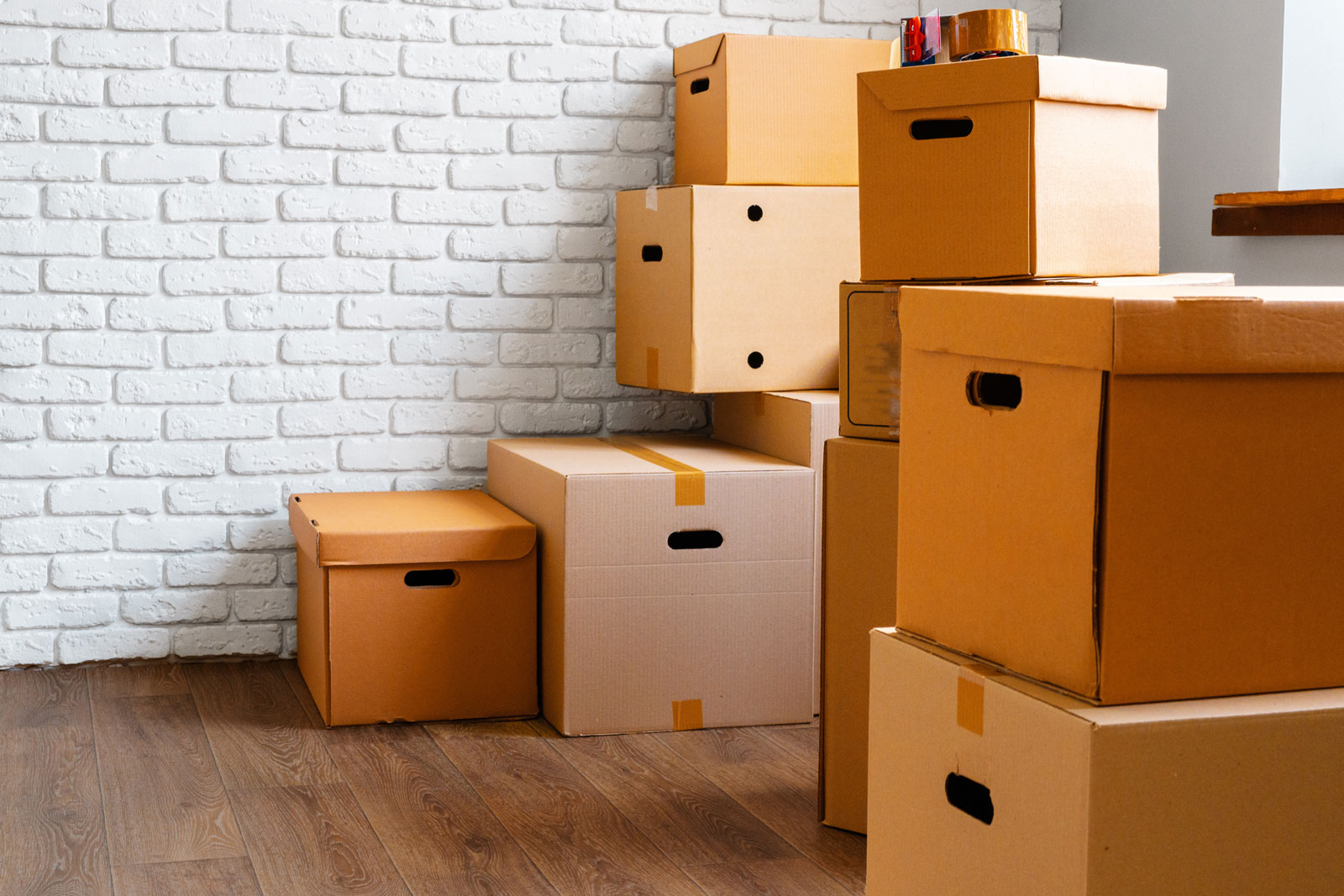 Close up of moving carton boxes in an empty room